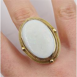 Large gold oval opal ring, with textured mount