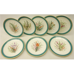  Set of eight Royal Worcester porcelain plates, decorated with floral sprays within a jewelled and turquoise blue leaf border with gilt edge, D23cm   
