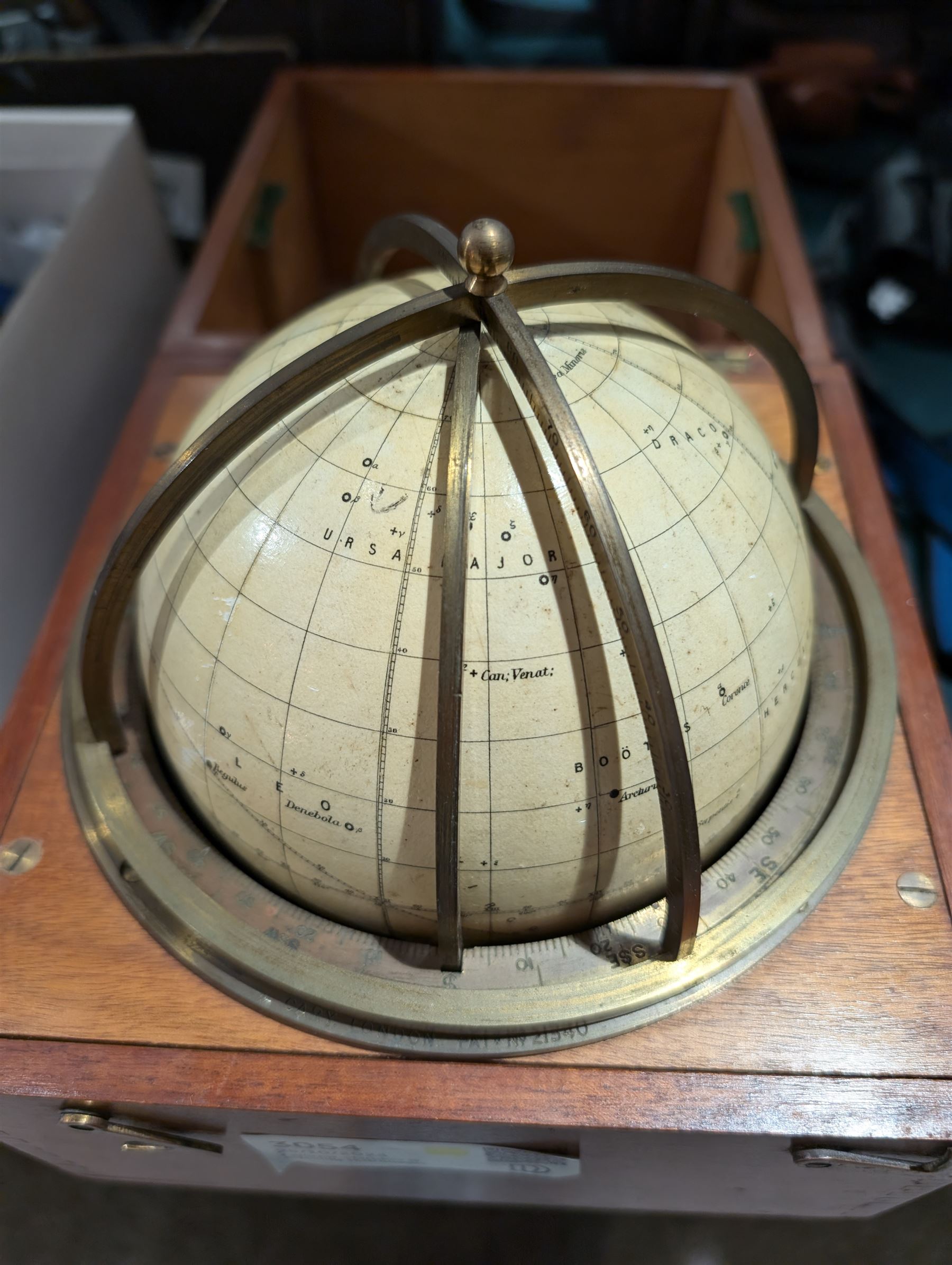 Cary Porter Ltd celestial navigational star globe patent no. 21450, the cream coloured sphere printed in black with stars and constellations, with brass meridian and horizon rings, contained within a fitted wooden box with paper instruction label to interior, globe diameter 11.5cm, box H21cm