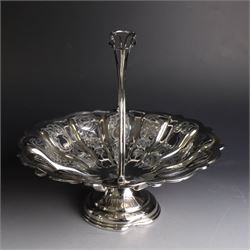 Edwardian silver swing handled basket, of circular form with shaped rim and engraved floral and foliate decoration, with know design swing handle and upon circular stepped pedestal, hallmarked J Sherwood & Sons, Birmingham 1901, H9cm, D22cm