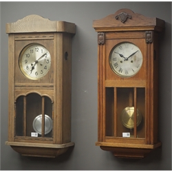  Large early 20th century oak cased wall clock, another oak cased wall clock and a stained beech cased 31-day wall clock  