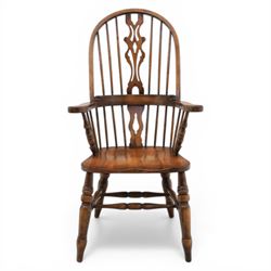 Late 20th century elm and beech high back Windsor armchair, the arched hoop back with pierced vase shaped splat between turned spindles, shaped arm rail on turned supports, saddle seat, raised on turned legs united by a crinoline stretcher