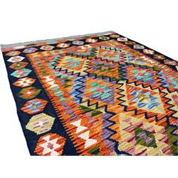 Chobi Kilim multi-colour rug, the amber field decorated with repeating lozenges, the indigo border with hexagons of alternating colours 