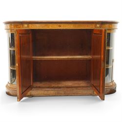 Large fine Victorian figured and burr walnut credenza, the breakfront D-shaped top with moulded edge, over an ornate frieze with inlaid Aesthetic Movement scrolling and geometric ornament, applied with gilt-metal ribbon-twist moulding and mounts, the central panelled doors profusely inlaid with scrolling foliate motifs and stringing, flanked by gilt-metal cartouche and scrolling acanthus corbel mounts, with flanking glazed bow-front side doors, on skirted base with further gilt metal foliate mounts