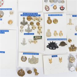 Collection of military cap badges, buttons and similar, including examples for Royal Army Medical Corps, Royal Army Pay Corps, Royal Engineers etc 