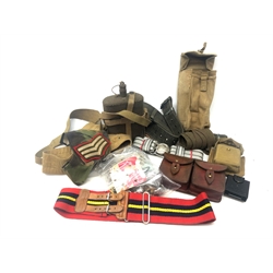  WW2 British bakelite marching compass by T.G. & Co in webbing pouch marked Finnigans Ltd.1943, British Army water bottle with cover and webbing strap, leather double cartridge pouch, Royal Artillery Stable belt, East German belt, 58-pattern field belt, assorted badges and buttons  