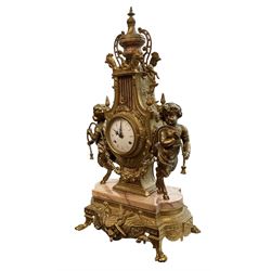 Imperial - 20th century continental 8-day brass and marble mantle clock, with an enamel dial, Roman numerals and pierced gilt hands, twin train striking movement sounding the hours and half hours on two bells, with a floating balance escapement.  With key.