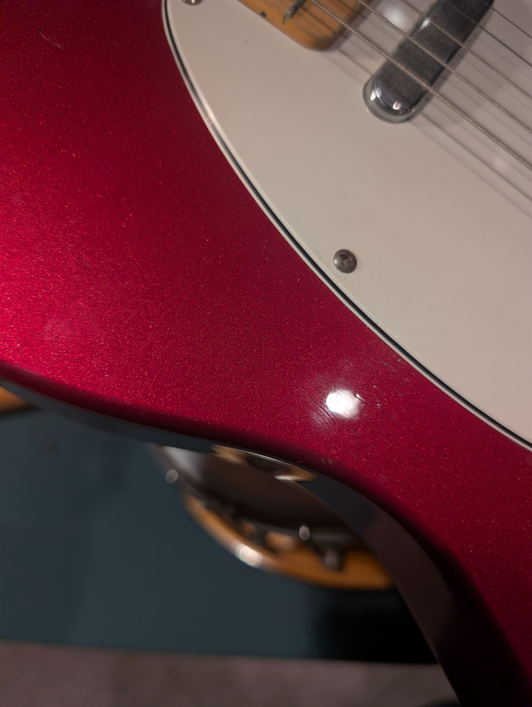 Fender Telecaster electric guitar, serial no. T021384 made in Japan c.1994, with Candy Apple Red body, white scratch plate and maple neck, guitar L98cm