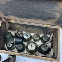 Pine box with hinge lid H22.5cm, L40cm, alongside a collection of shop bells and cow bells. 