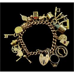 9ct rose gold curb link bracelet, with heart locket clasp and twenty 9ct gold charms, including crab, champagne bucket, camera, rabbit  and telephone box, 22ct gold 1852 1 Dollar coin and an 18ct gold charm