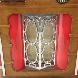 Rudolf Wurlitzer Company - Model 616 'Simplex' 1937 jukebox, figured walnut veneered cabinet with illuminated red and amber side panels enclosed by chromed uprights, glazed upper record compartment, cast Art Deco speaker grille, coin-operated push-button selection panel with circular title index, raised on a moulded base
