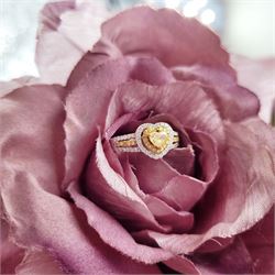 18ct white gold diamond heart cluster ring, principal heart cut fancy yellow diamond of approx 0.25 carat, surrounded by two halos of fancy yellow and white diamonds and split diamond set shoulders, Birmingham 2008, total diamond weight approx 0.50 carat