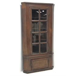 19th century stained pine barrel back corner cupboard, moulded cornice, astragal glazed door enclosing three shaped shelves, single cupboard, plinth base, W89cm, H173cm, D38cm