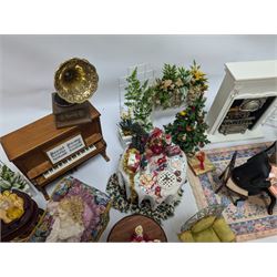 Dolls house furniture, including pianos, fireplace, plants, flower arrangements, tables, chairs, six figures and a collection of instruments and other accessories
