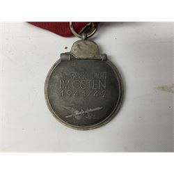 WW2 German Eastern Front Medal awarded to those who served on the German Eastern/Russian Front during the Winter Campaign period of 15th November 1941 to 15th April 1942 with original ribbon; and German War Merit Cross with swords 2nd Class (2)