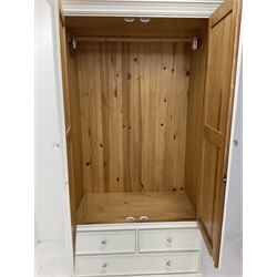 Pine painted wardrobe, projecting call Nice, two cupboard doors enclosing hanging rail above too short and one long draw, platform base