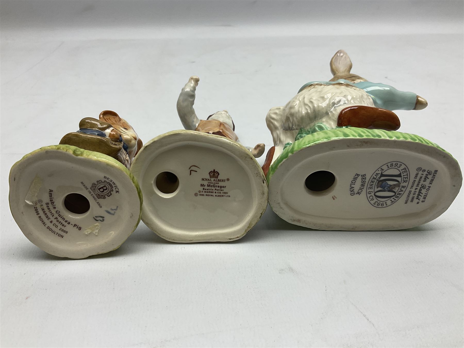 Six Beswick Beatrix Potter figures, comprising Miss Moppet, Tommy Brock, Peter Rabbit, Cecily Parsley, Mr Drake Puddle-Duck, Amiable Guinea Pig, together with four Royal Albert figures, Hunca Munca, Lady Mouse made a curtsy, Little Pig Robinson and Mr McGregor, all with printed mark beneath  (10)