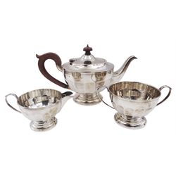 1920s three-piece silver tea service, comprising teapot with Bakelite handle and finial, milk jug and twin handled open sucrier, each of circular faceted form, hallmarked Henry Clifford Davis, Birmingham 1928, teapot H16.5cm