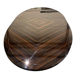 Giorgio Collection - Art Deco design macassar ebony 'Luna' extending dining table, oval top with quarter-matched veneer and stringing, raised on a curved V-shaped pedestal with oval base; with matching set of dining chairs, high macassar ebony back, the lower half and seat upholstered in black leather, on ebonised tapering supports, retailed by Harrods