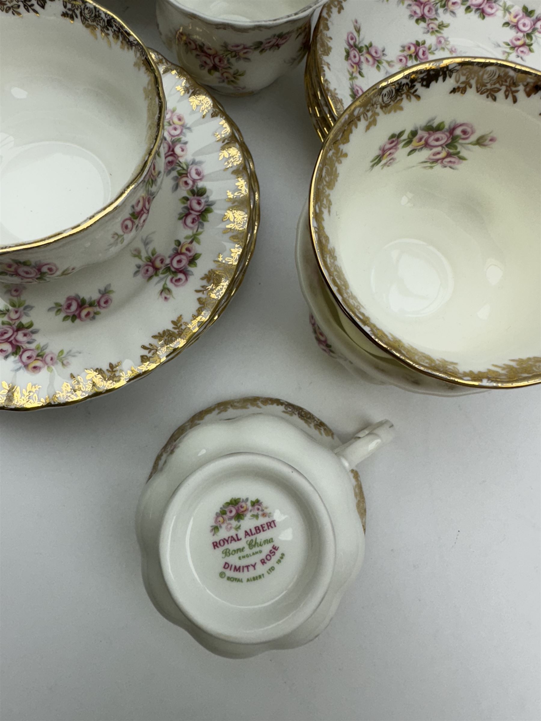 Royal Albert Dimity Rose pattern tea service for six place settings, including teapot, teacups and saucers, sugar bowl and two milk jugs, all with printed mark beneath