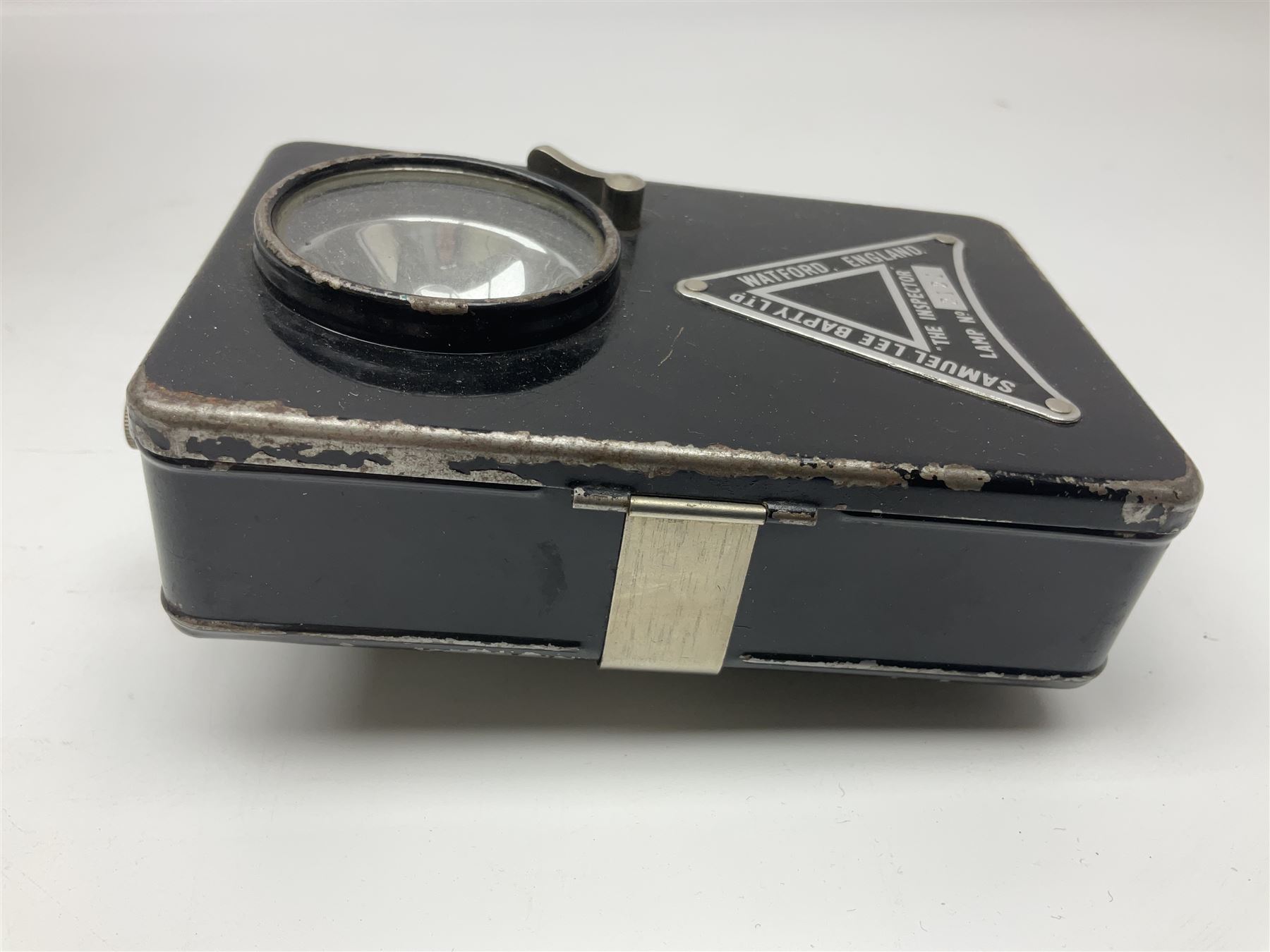 Police - Victorian turned hardwood truncheon with traces of decoration and VR cypher L42cm; Humberside Police helmet with Queens Crown helmet plate; hand lamp inscribed 'The Inspector'; and small pair of pewter figures of police officers (5)