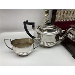Silver handled Kings pattern bread knife, together with a canteen of silver plated Kings pattern cutlery by K Bright Ltd, in wooden fitted case, silver plated four piece tea service, toast rack, cruet set and pair of candlesticks