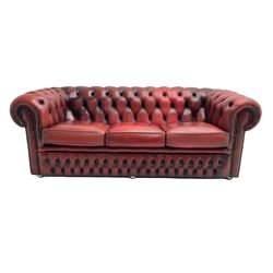 Three seat Chesterfield sofa, upholstered in deeply buttoned red leather