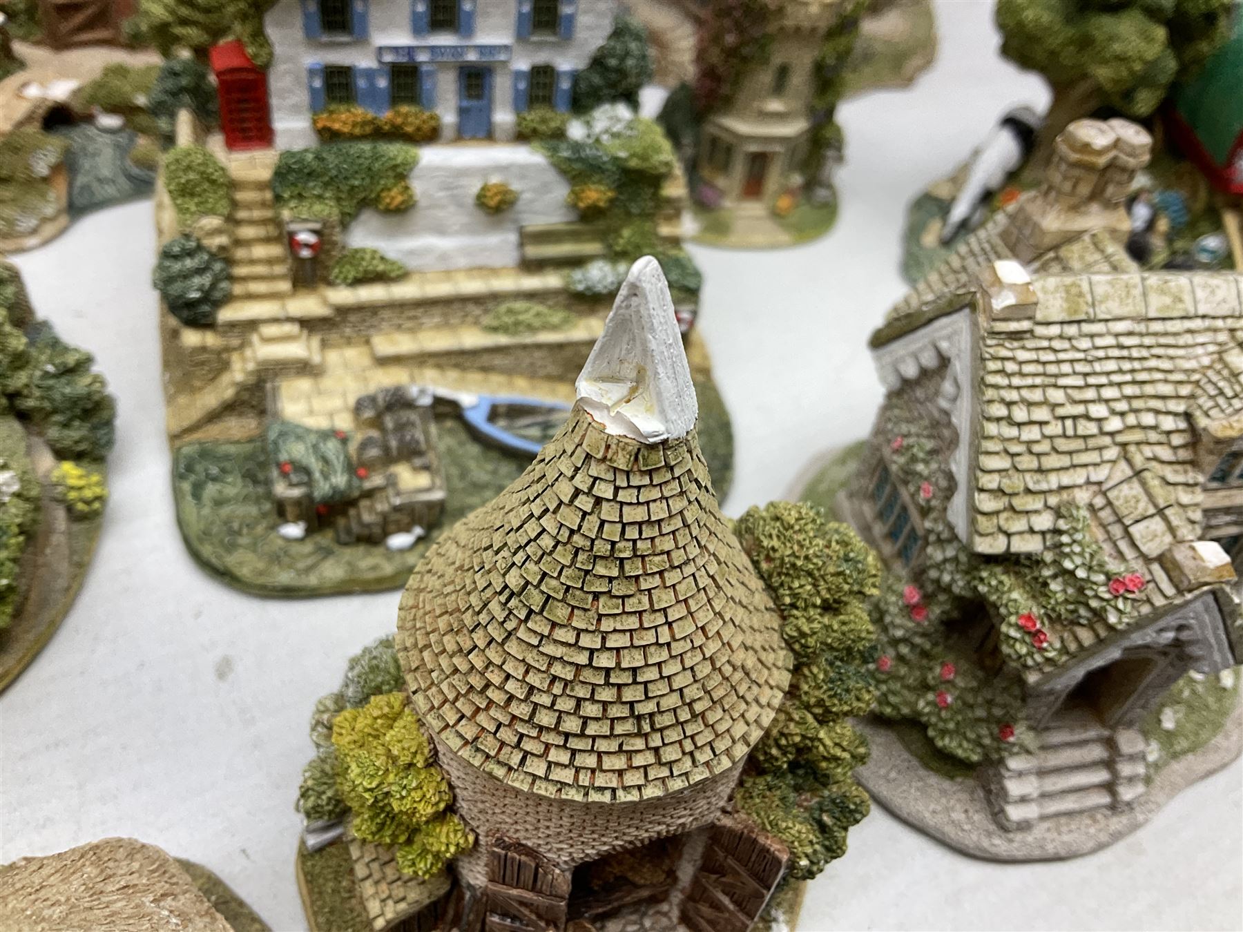 Sixteen Lilliput Lanes, to include The Golden Jubilee, Round Tower - Windsor Castle, Castle of the Golden Chalice, Travellers Rest, with box and deed,  Summer Days, Sunshine Creek, Writing with Lewis Carol, with box and deed,  etc 