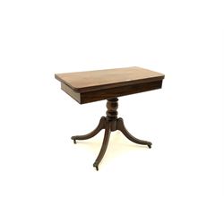Regency mahogany pedestal table, fold over swivel top, raised on turned column to meet shaped supports and hairy paw brass castors 