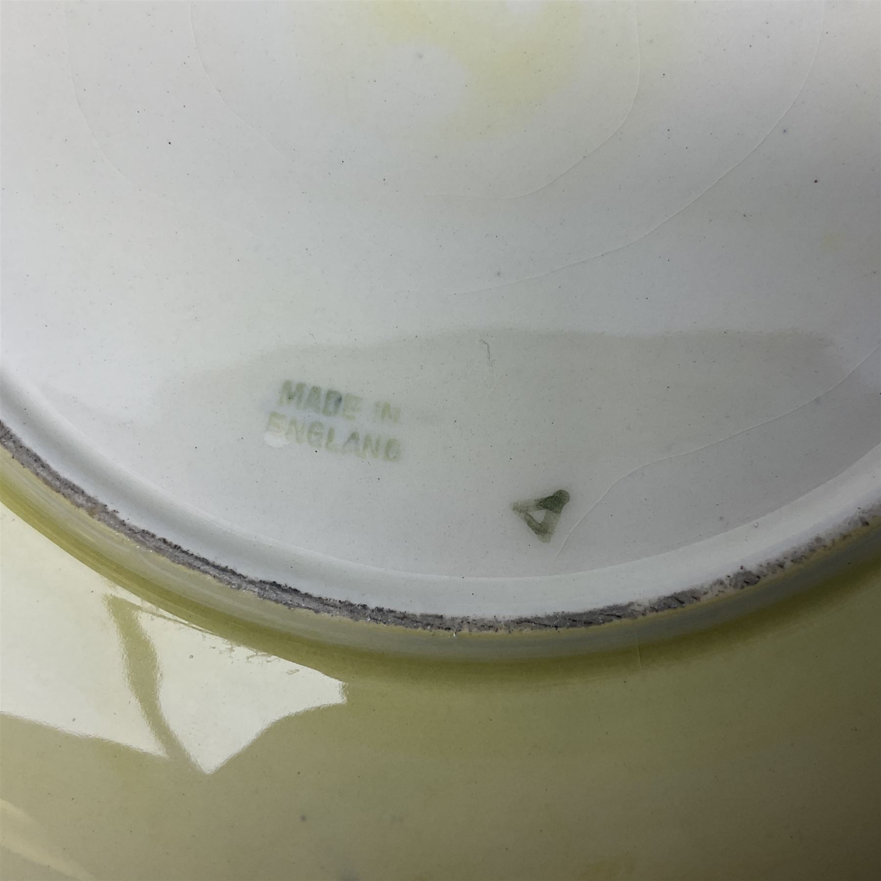 Moorcroft Tiger Lily pattern plate on a yellow ground, with painted and impressed mark beneath, D26cm