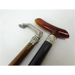  Late Victorian ebonised waling stick with cherry amber style handle and silver collar, Chester, 1897, L90cm and a Partridge wood cane with cast handle modelled as a horse's knee and hoof (2)  