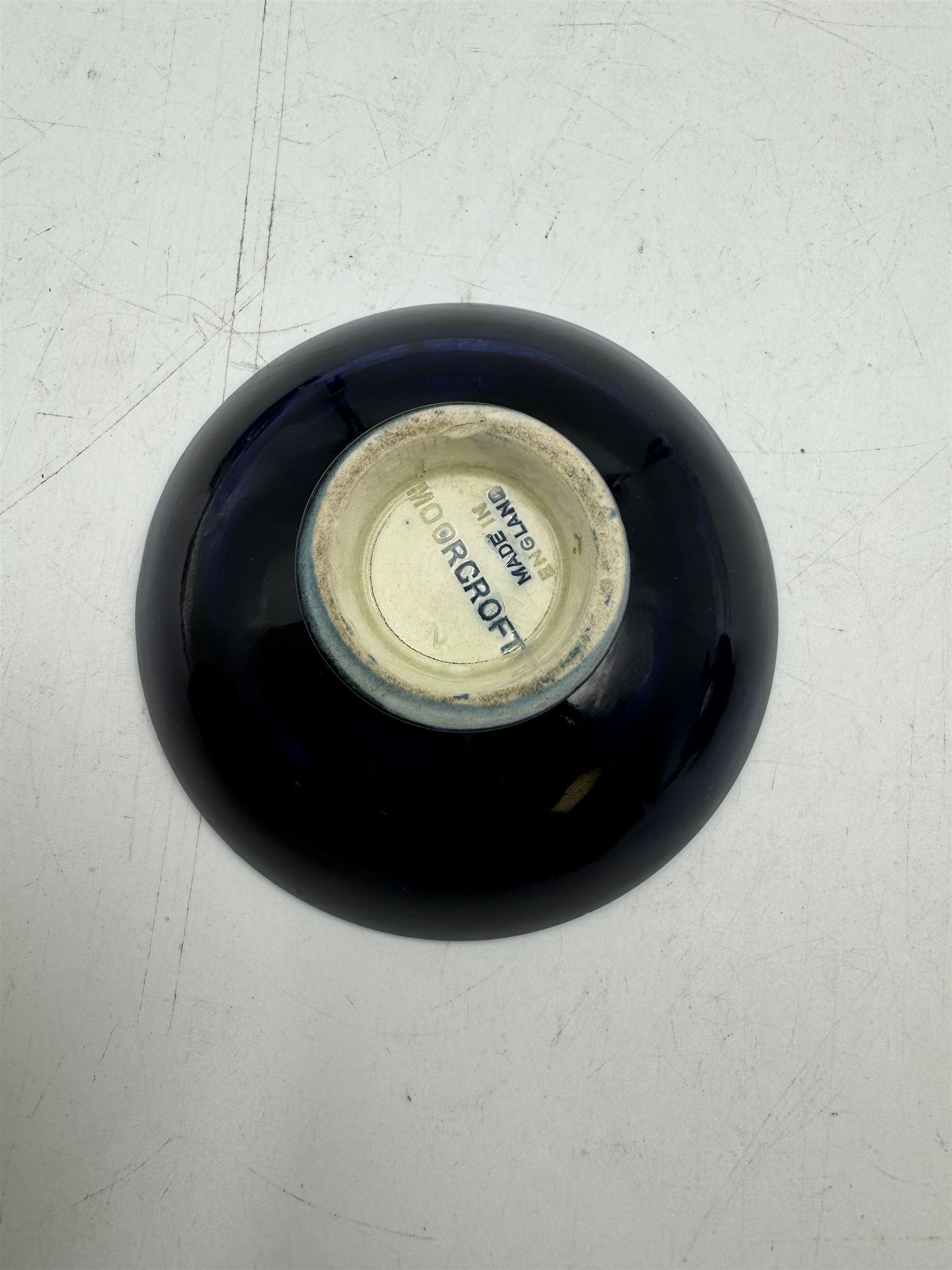 Moorcroft pewter-mounted circular ashtray decorated in Pomegranate pattern, together with Anemone pattern ashtray and trinket dish, all with makers mark beneath    