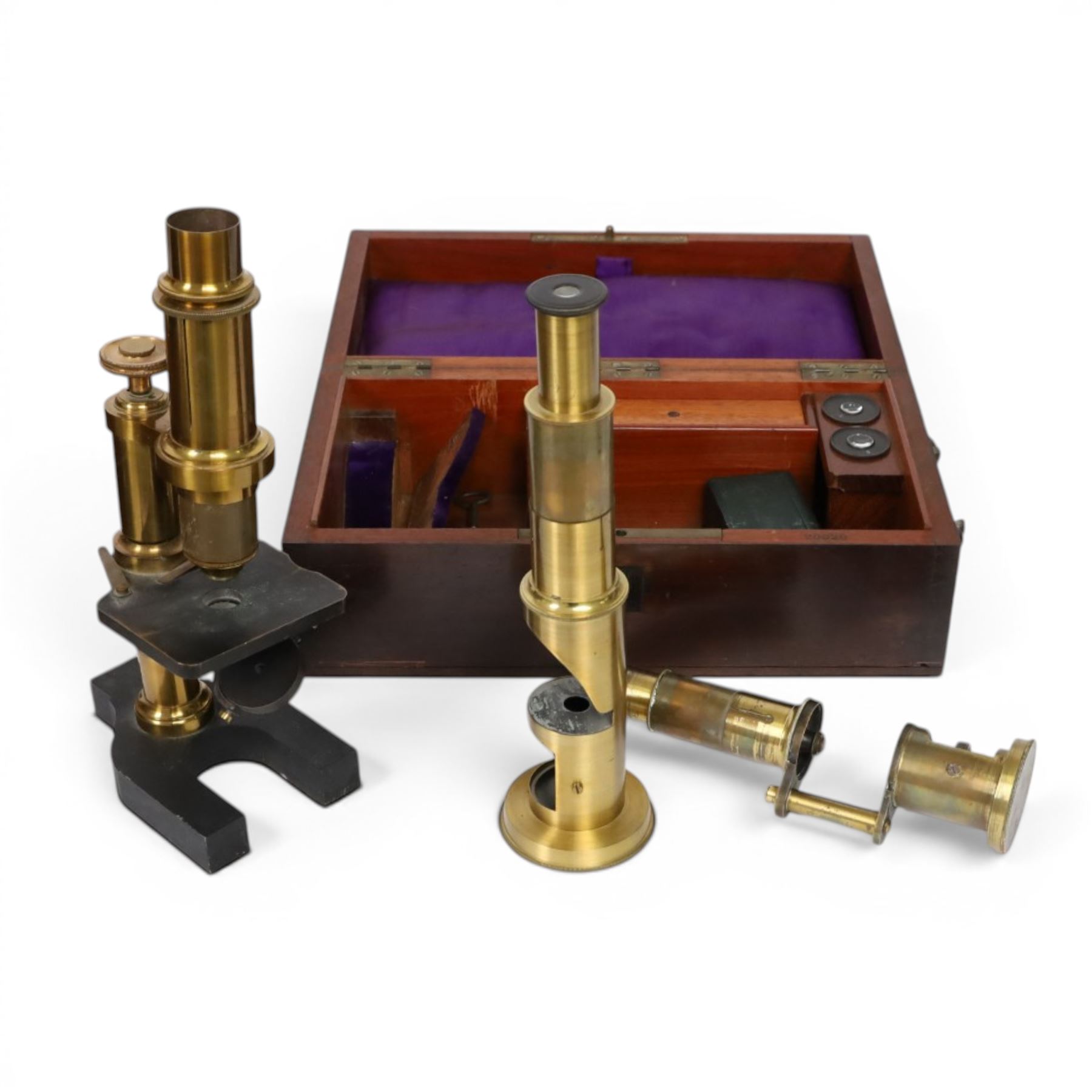19th century brass monocular microscope by Hartnack & Prazmowski, in fitted case incscribed David Marr London, with two eyepieces, together with two further brass monocular microscopes