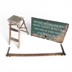 Private woodland walk wooden sign along with large saw and wooden step ladders