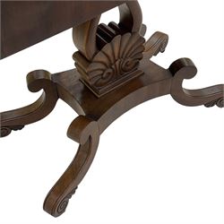 19th century mahogany tea table, fold-over swivel rectangular top with rounded corners, the frieze decorated with carved leaf motifs and applied beading, lyre shaped support on carved anthemion, rectangular platform on four out-splayed S-scroll supports with brass castors 