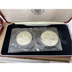 Coins including two King George VI 1951 Festival of Britain crowns each in green case, various other commemorative crowns, two Iceland '874-1974' two coin sets both in original red cases etc