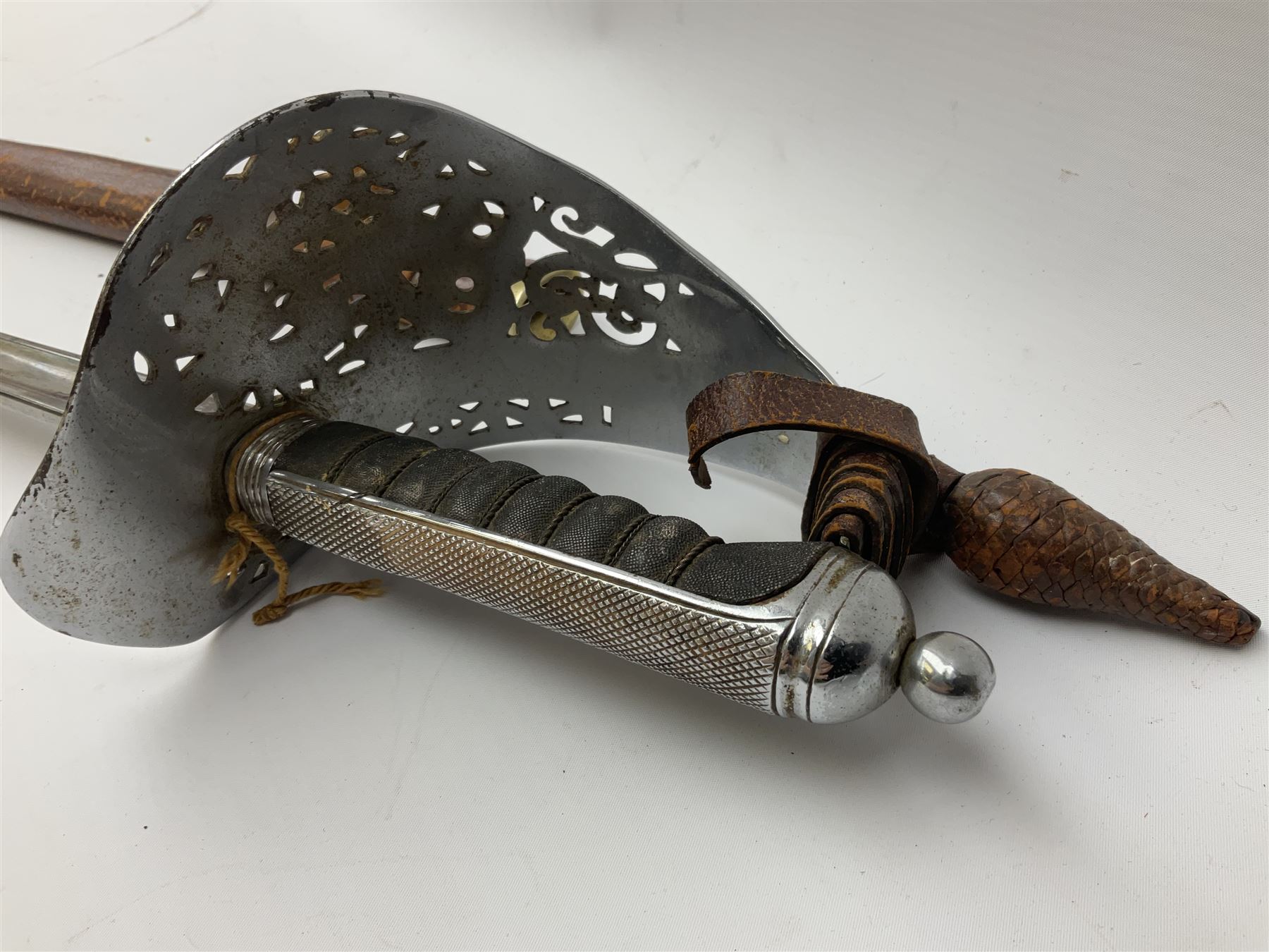 British George V 1897 Pattern Infantry Officers Sword, the 82.5cm fullered steel blade etched and polished with crowned royal arms, GRV cyphers and scrolling foliage, marked Army & Navy Co-operative Society 105 Victoria St London SW to the ricasso,  plated pierced basket hilt with wire bound fish skin grip and leather knot, No.15032; in leather covered scabbard