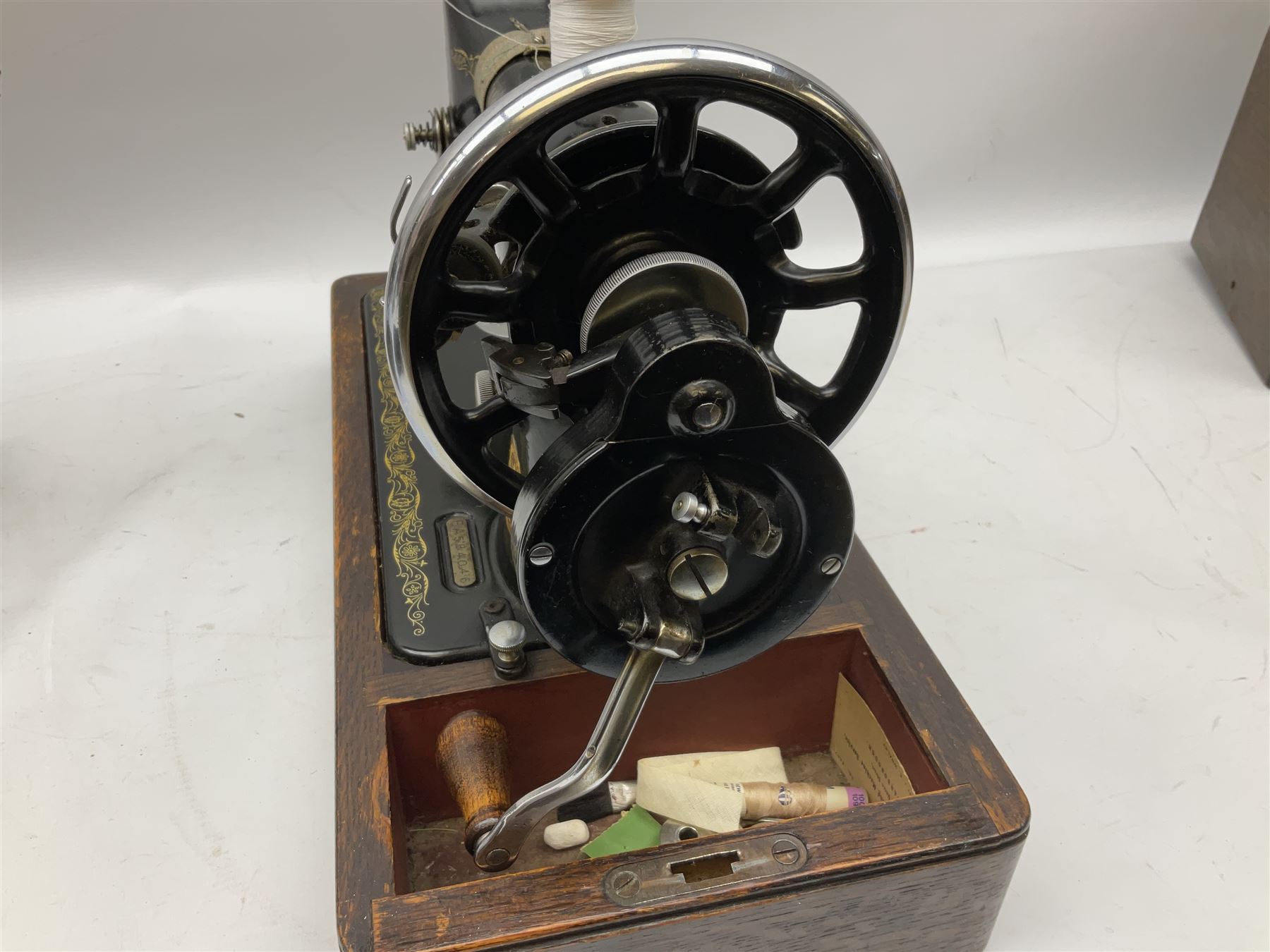 Singer sewing machine no. EA584046 in case (missing key) and Singer Manual of Family Sewing Machines