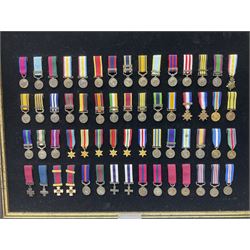 Two limited edition large framed display boards with half-size copies of British Gallantry and Campaign Medals produced by Danbury Mint and entitled 'For Valour'. Sixty medals on each board, all with ribbons. Complete with Danbury Mint certificate serial number A0148 and other paperwork.