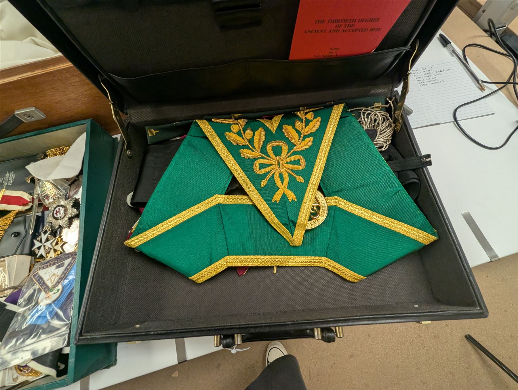 Collection of Masonic jewels and regalia, including robes, sashes, gloves, medallions, etc, in a number of briefcases and boxes