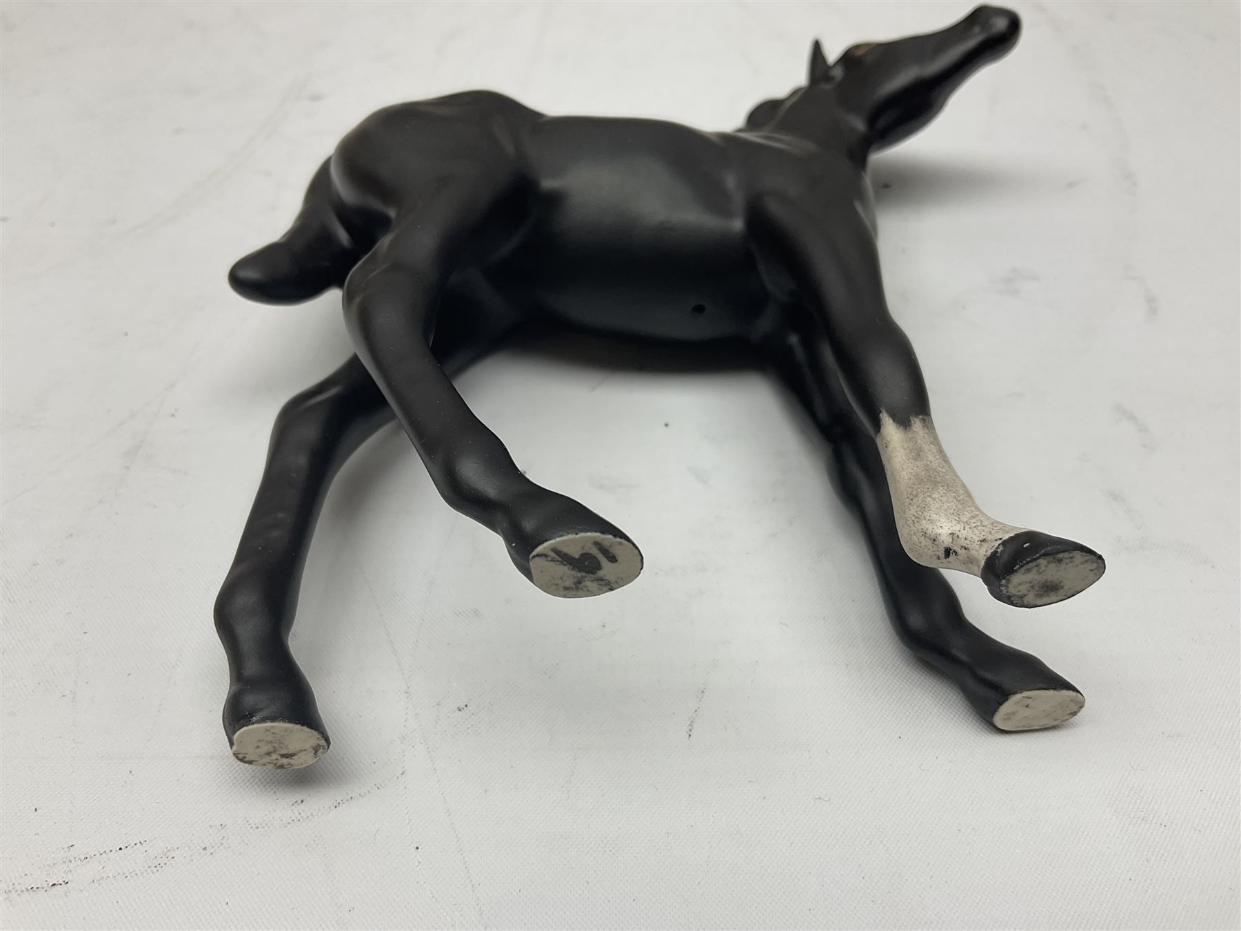 Four Beswick horses, including Exmoor no 1645, Black Beauty foal and two others 