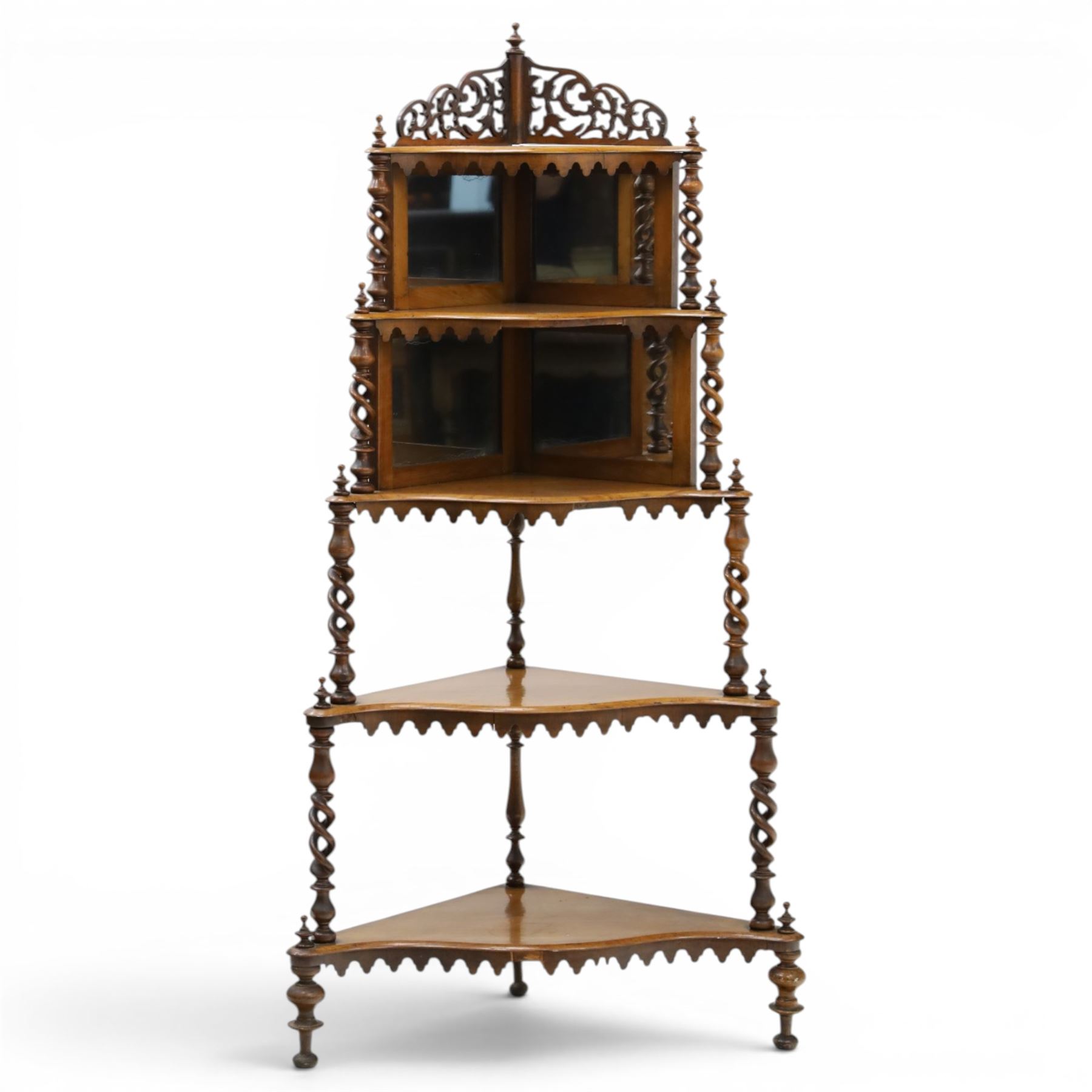Victorian mahogany five-tier corner whatnot, raised and pierced back of scrolling foliate design, over two tiers with mirror backs and pear-drop moulded aprons, united by pierced spiral-turned uprights, on turned feet