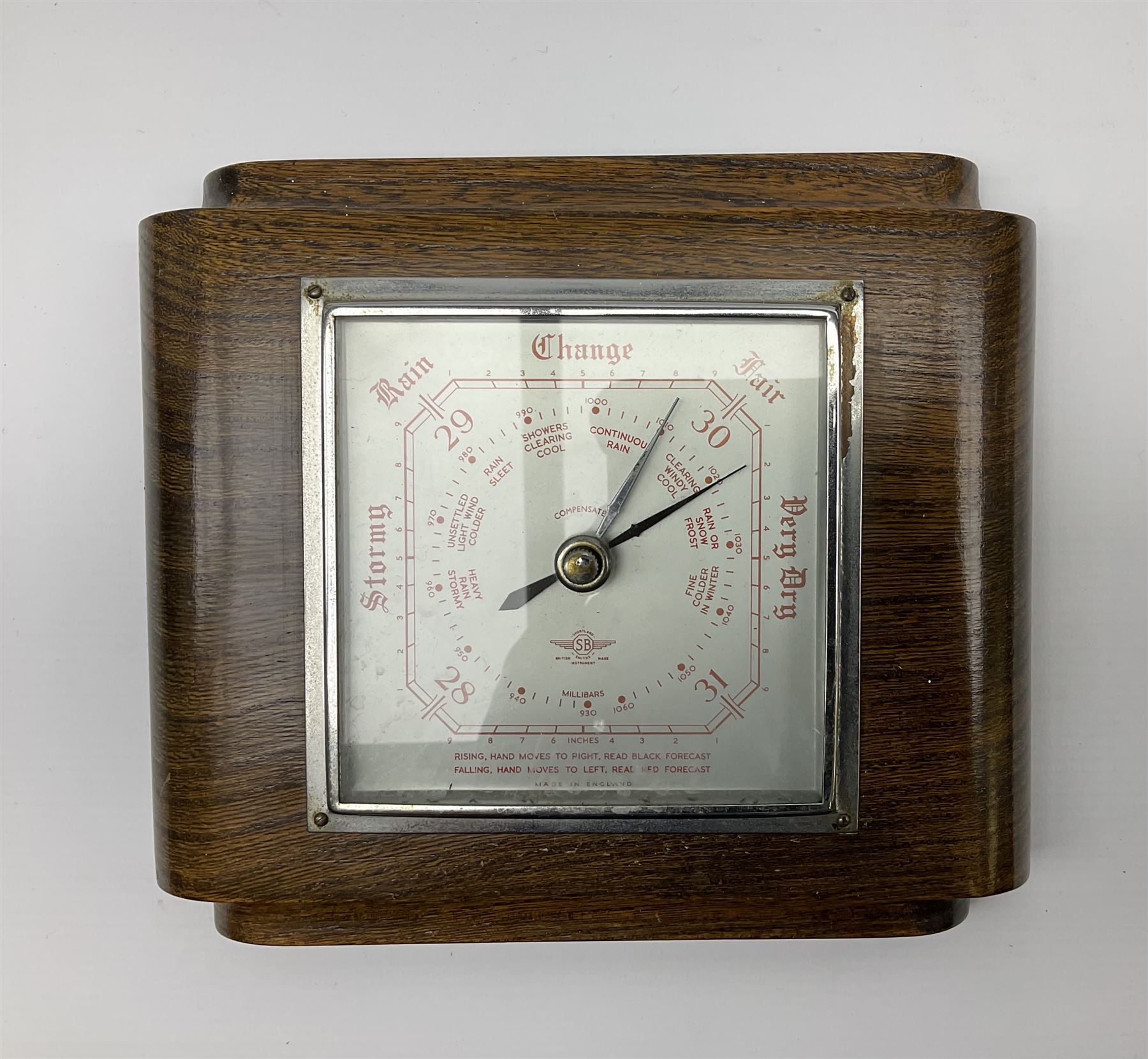 Two pairs of Balinese carved wooden bust figures of a man and woman, with elaborate head dresses, along with other wooden carved figures, a small barometer and a framed print. 
