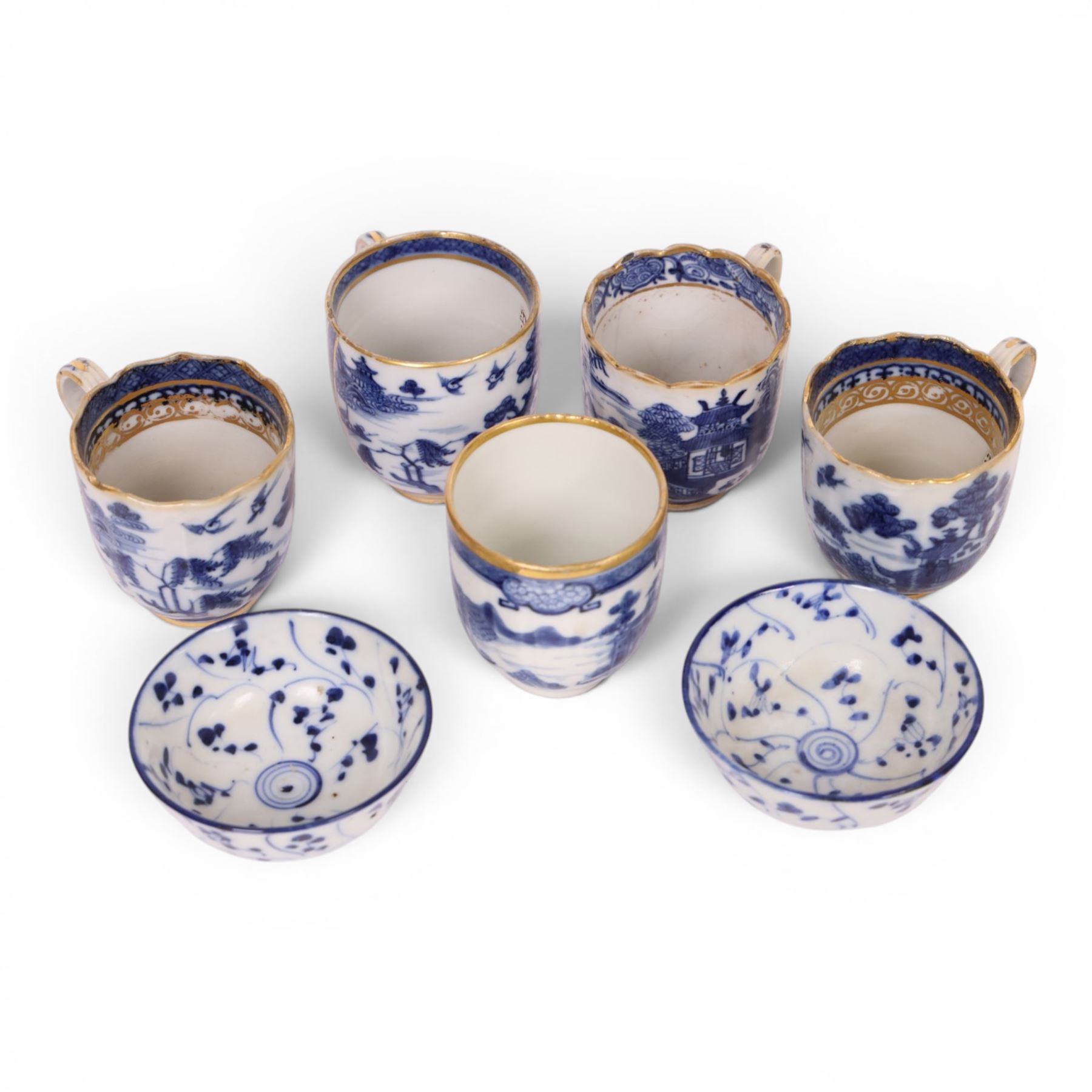 Five 18th century Qing Dynasty export coffee cups, all similar decoration in blue and white with gilt detail, together with two tea bowls  