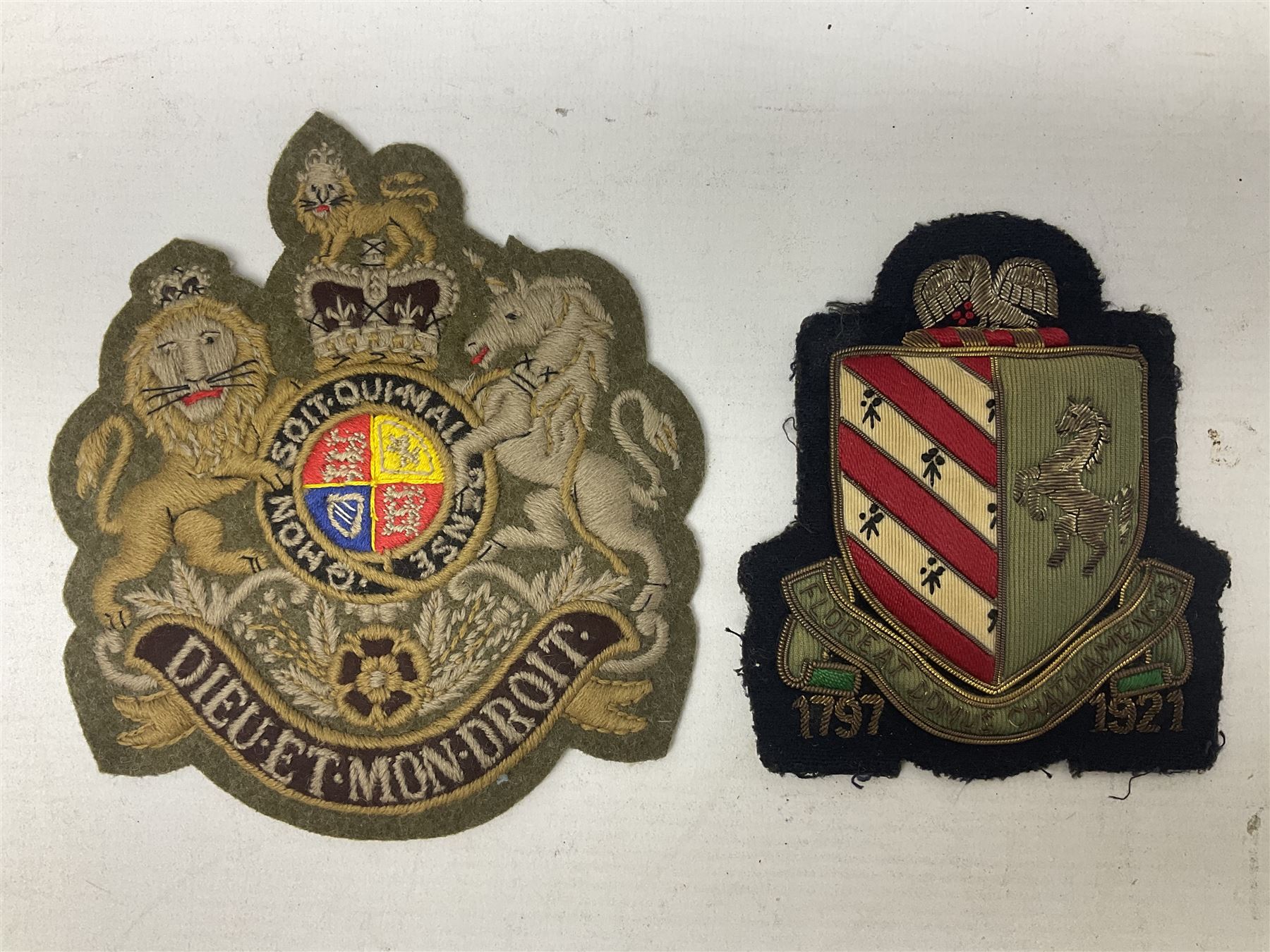Royal Arms cloth arm adge as worn by Regimental Serjeant-Majors in Foot Guards; naval cap badge; WW2 Commando/Special Forces cloth badges; Home Guard and LDV shoulder titles; and other cloth badges including armoured division, 45th and 77th division, 52nd Lowland Mountain division etc; and 24th Infantry Brigade airmobile pennant