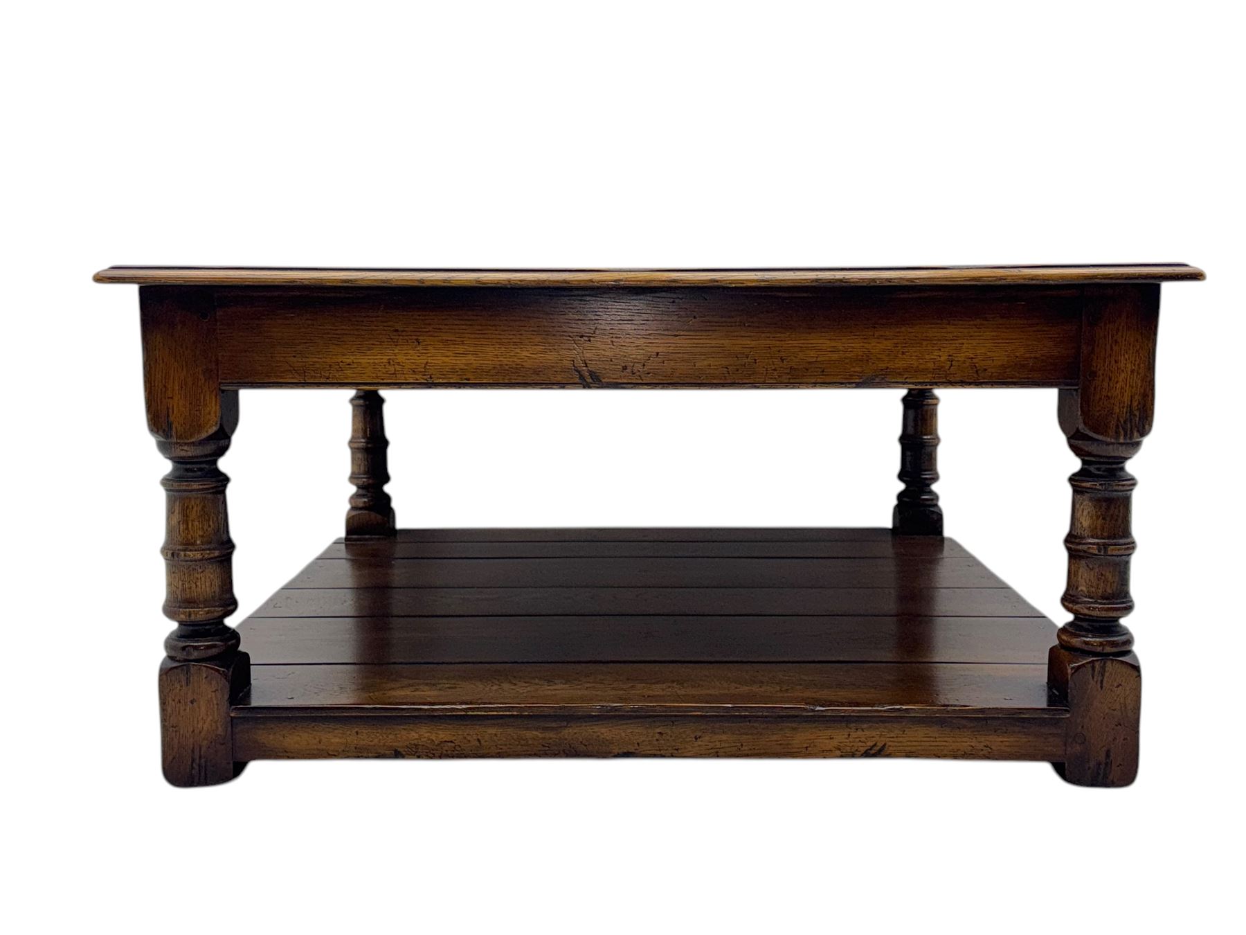 Oak coffee table, square moulded top on turned supports united by undertier 