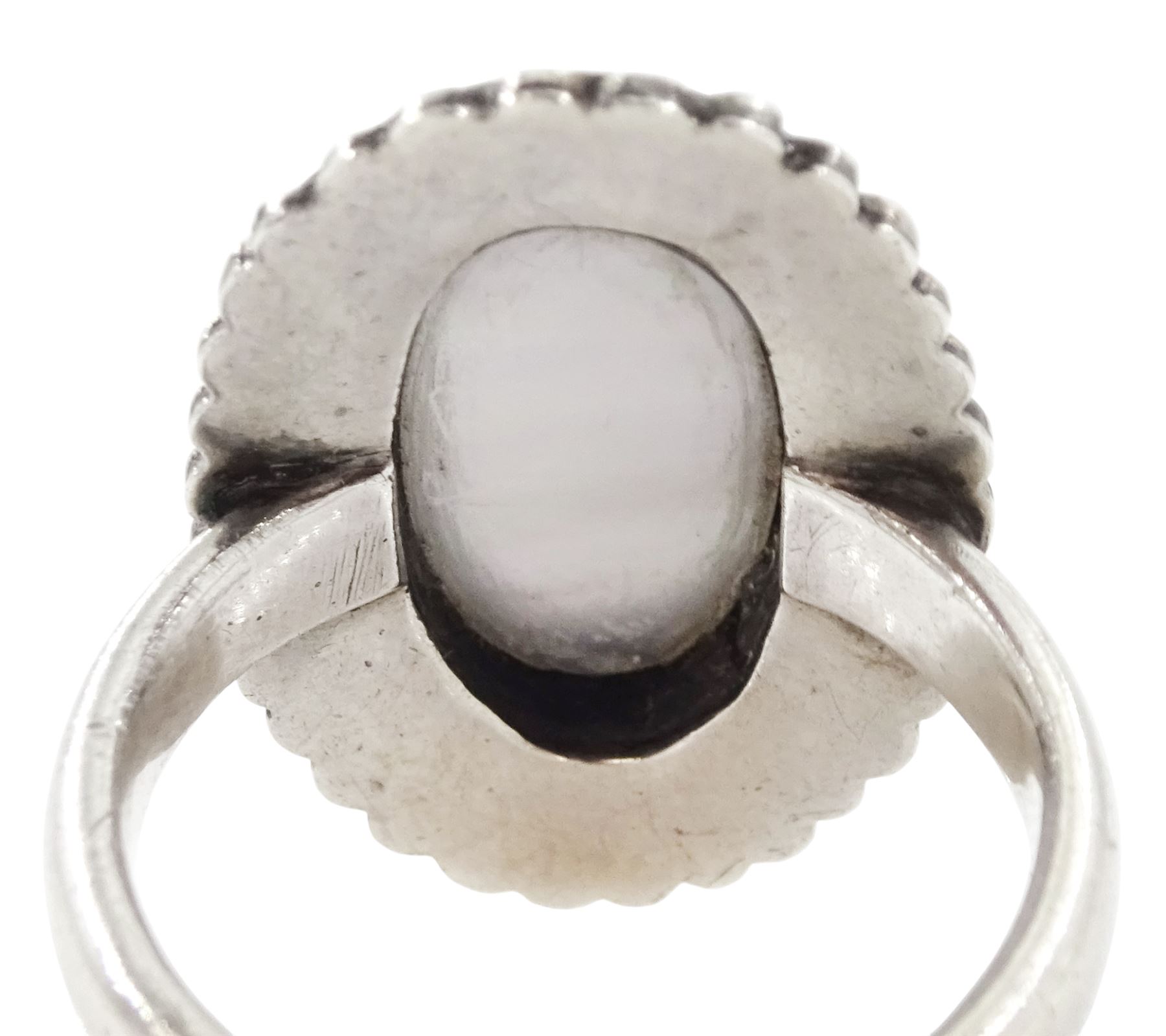 19th century French silver enamel portrait ring, set with an oval hand painted panel of a cherub, with split pearl surround