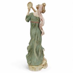 Royal Dux female figure holding a tambourine in burnished gilt and on circular naturalistic base, model no.1430 H27cm