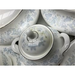 Royal Doulton tea and dinner wares in the Meadow Mist pattern, no H5007, comprising seven dinner plates, eight side plates, two lidded tureens, two jugs, lidded sucrier, oval serving dish, six teacups, seven saucers, seven tea plates and large saucer