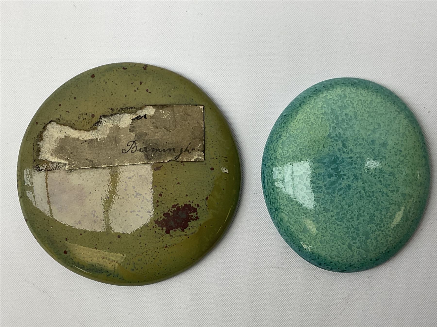 Henry George Murphy (1884-1939), collection of seven Arts & Crafts glazed ceramic roundels, of circular and oval form, five in tones of red and brown and two in tones of blue, turquoise and green in soufflé and high fired finishes, largest example D6.5cm